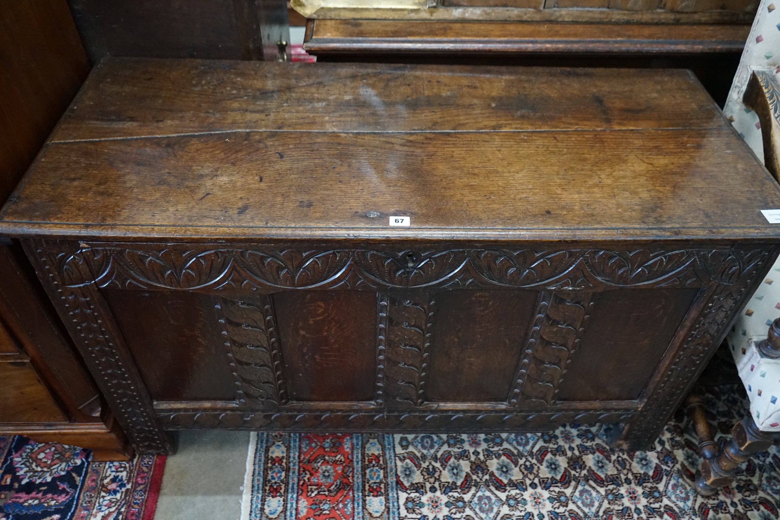 A late 17th / early 18th century carved oak coffer, length 127cm, depth 52cm, height 73cm